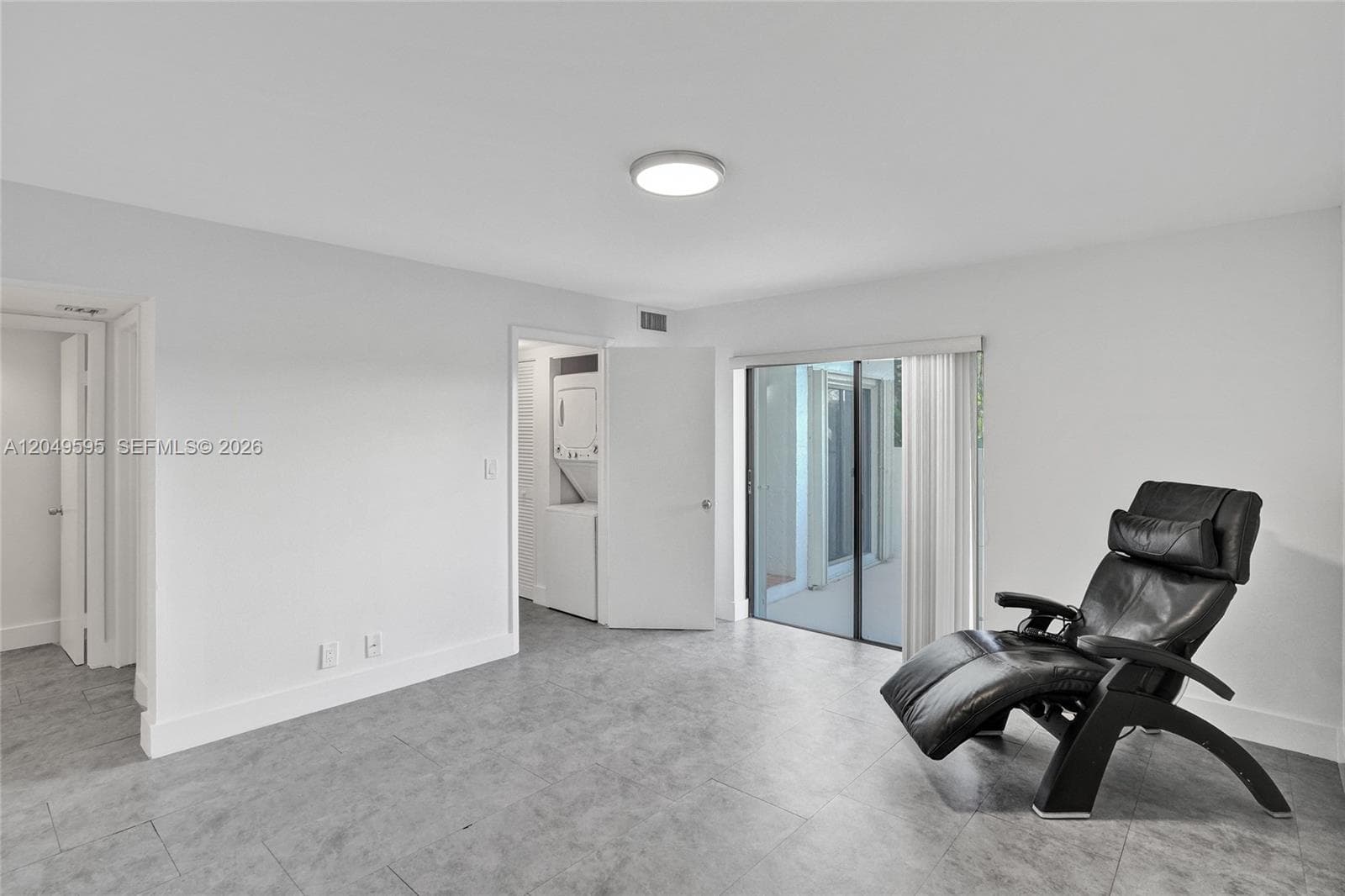 Primary bedroom large enough for an office or relaxing on a chair