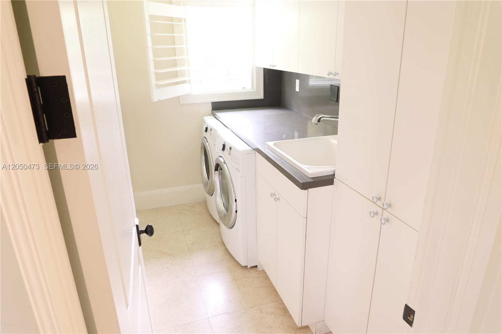 Laundry room next to maid's in quarter area