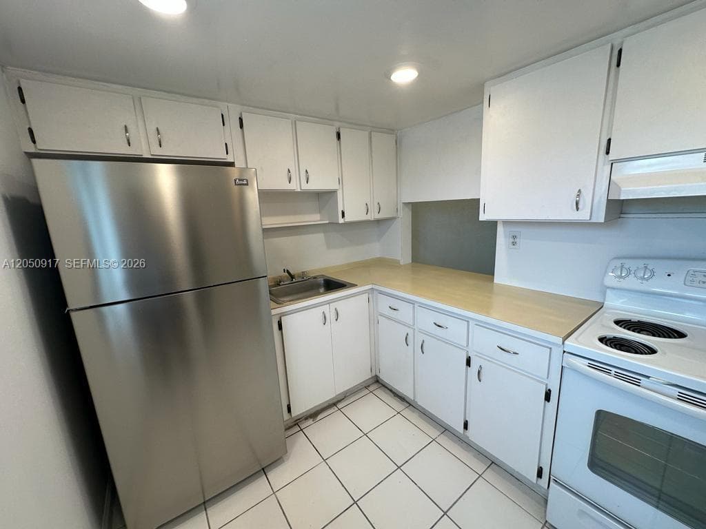 NEW WORLD CONDO APTS IV · #111 in Miami Gardens - Photo 2