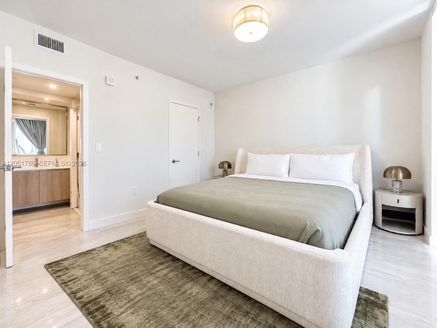 Neutral interior featuring polished stone-finish flooring, a contemporary semi-flush mount drum light fixture, and minimalist solid-core interior doors
