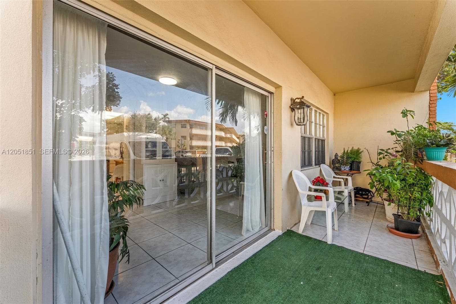 lush landscaping on your balcony with exit directly to the parking