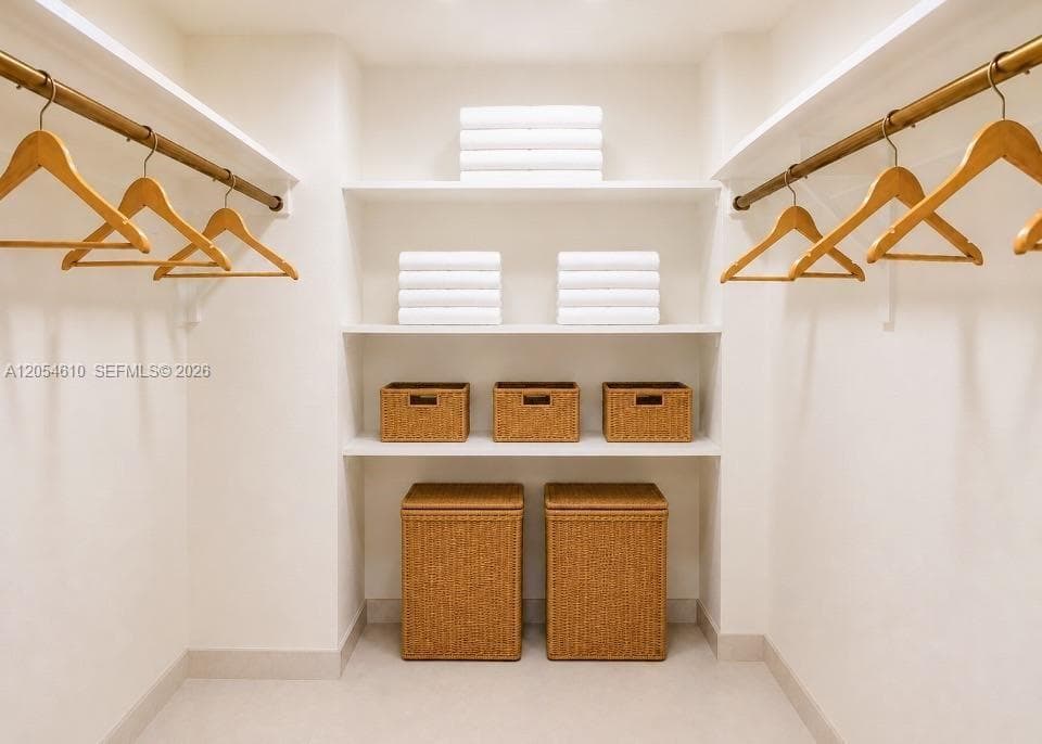 PRINCIPLE BEDROOM SUITE WALK-IN CLOSET ONE