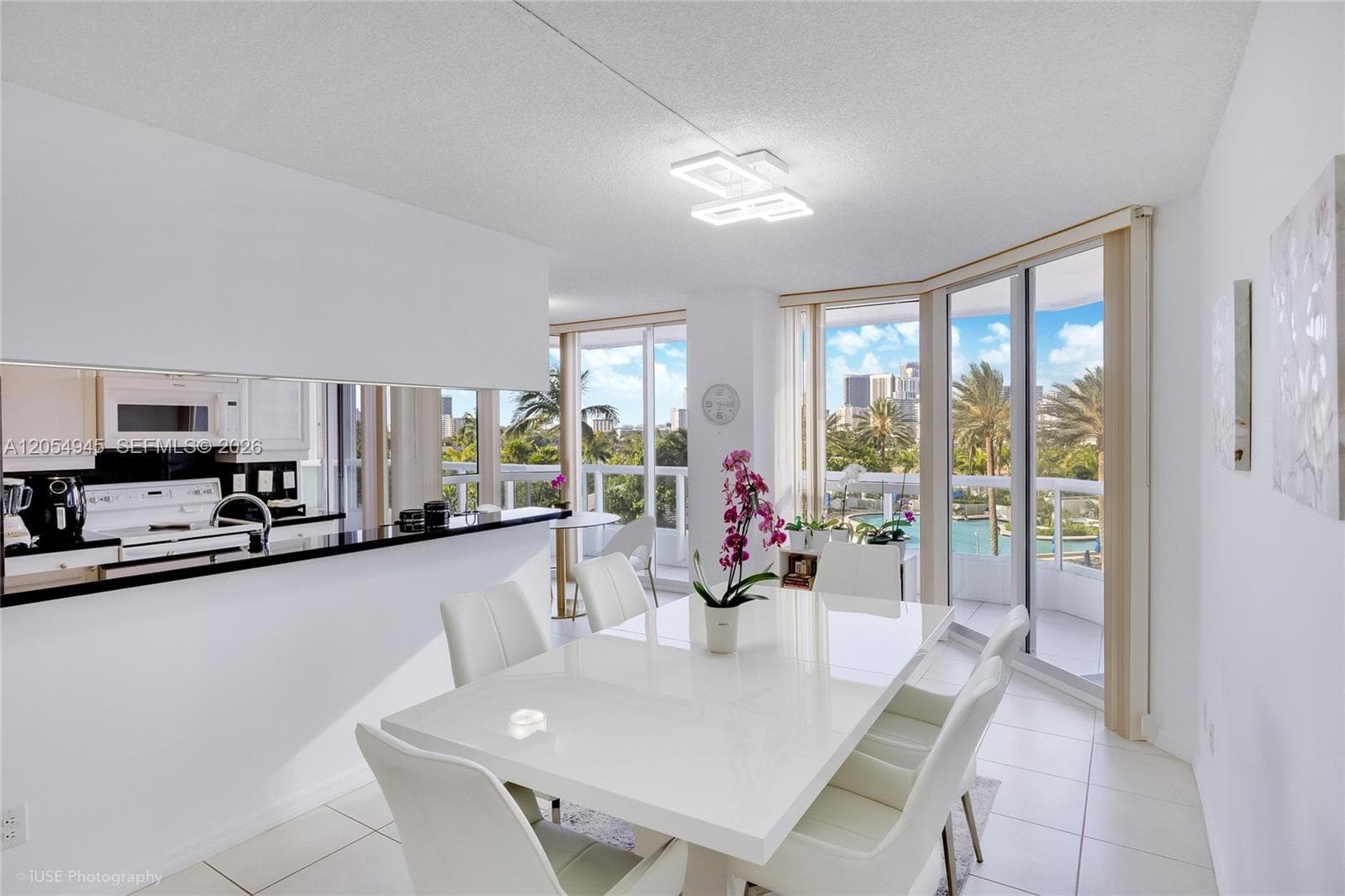 Open floor plan dining area, open kitchen, and breakfast area