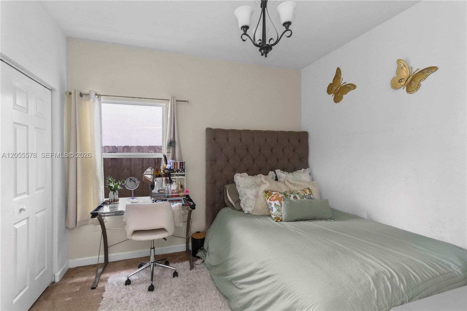 Bright and versatile, this cozy bedroom features a functional layout that includes a dedicated workspace, making it the perfect room for rest, study, or relaxation