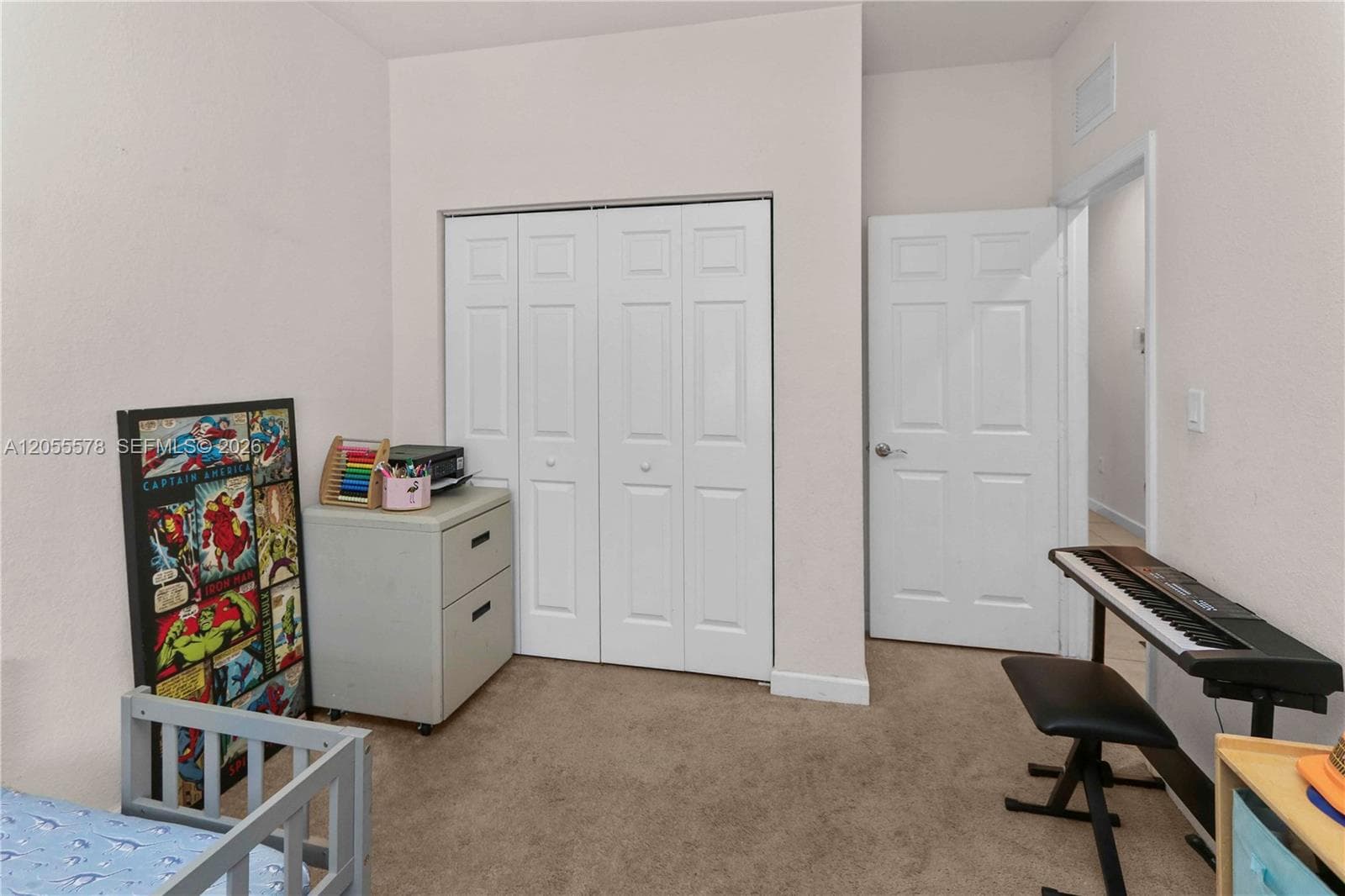 Versatile and spacious, this well-proportioned bedroom offers a comfortable layout with great closet space, making it an ideal choice for a guest room, home office, or a peaceful nursery.