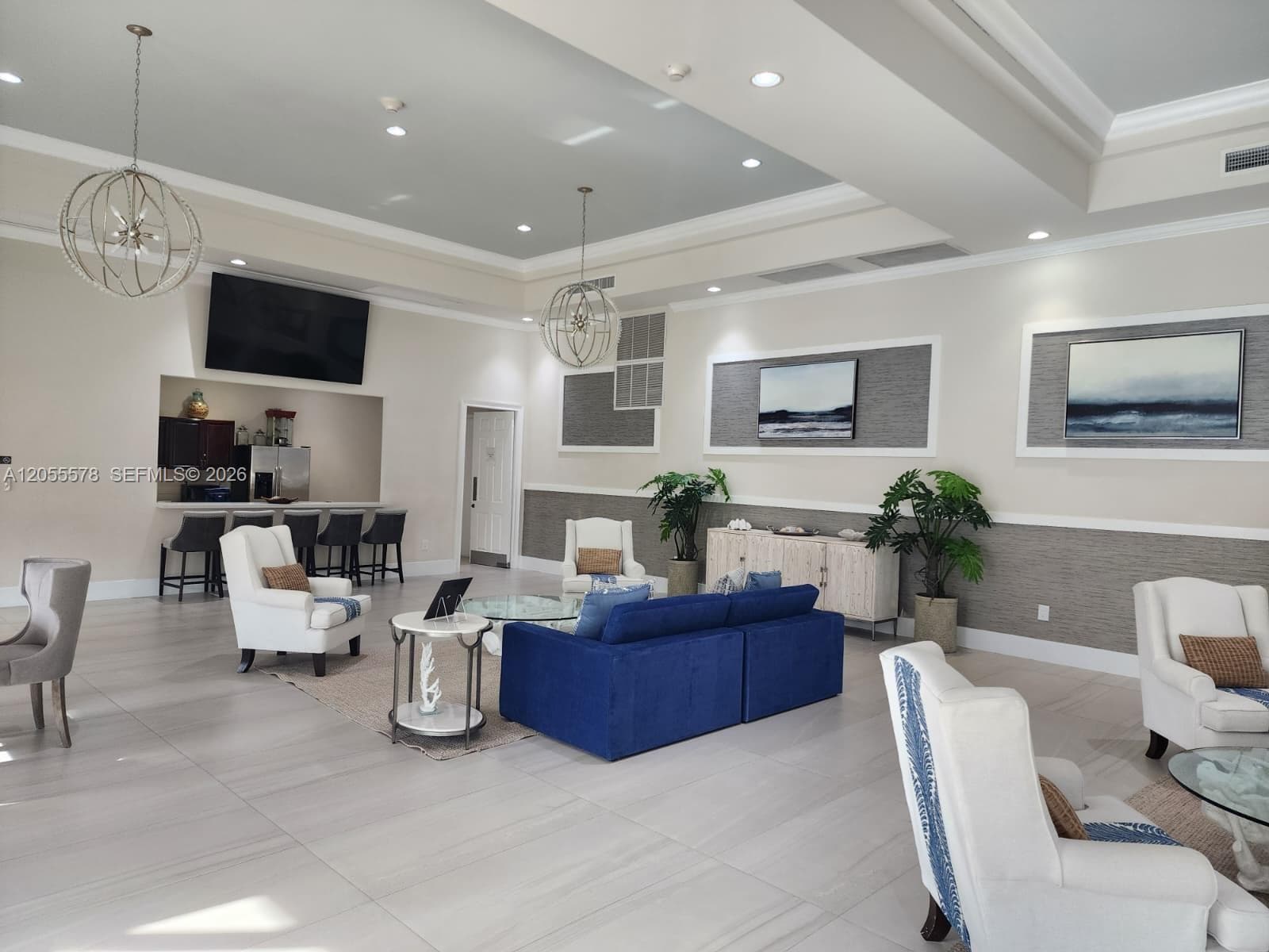 Versatile and bright social area. This interior space within the clubhouse offers a spacious and comfortable setting, perfect for community gatherings or private celebrations.