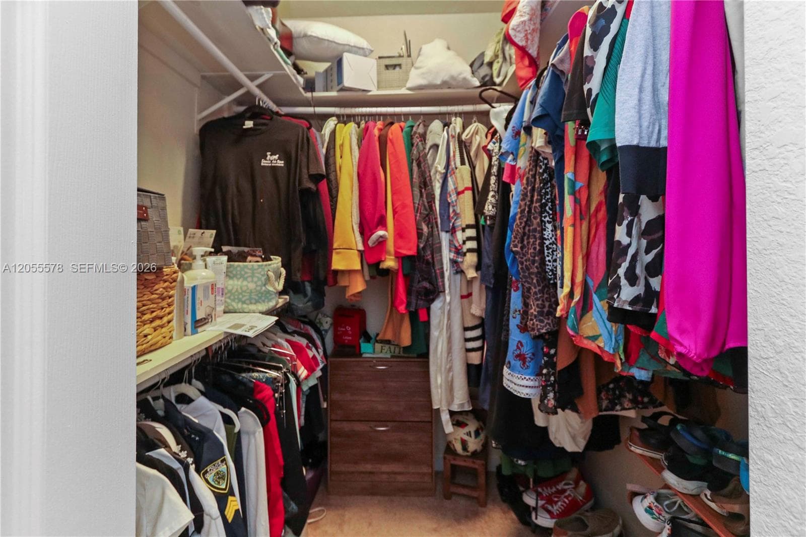 Maximize your storage! This spacious walk-in closet in the primary suite offers an efficient and organized layout, providing plenty of room for all your wardrobe needs.