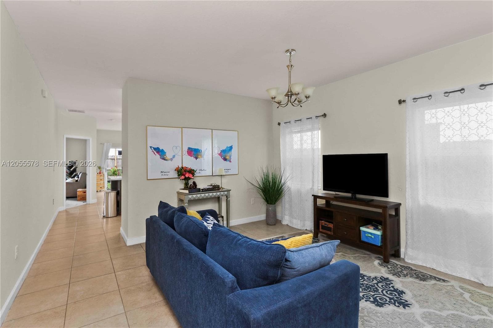 Designed for effortless living, this open floor plan provides a seamless flow from the living area to the primary suite, highlighting the home's thoughtful layout and spacious feel