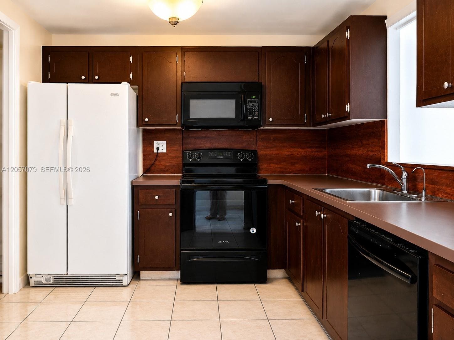 Kitchen with dark cabinetry