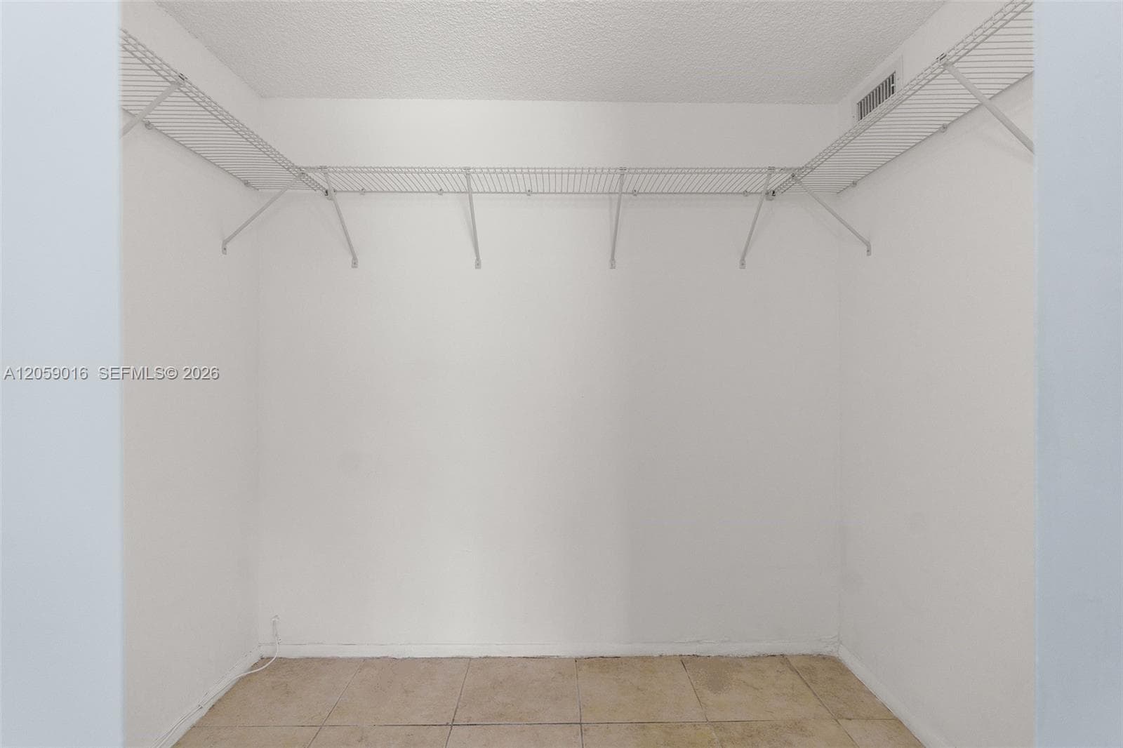 1 of 2 Walk-In Closets in Bedroom