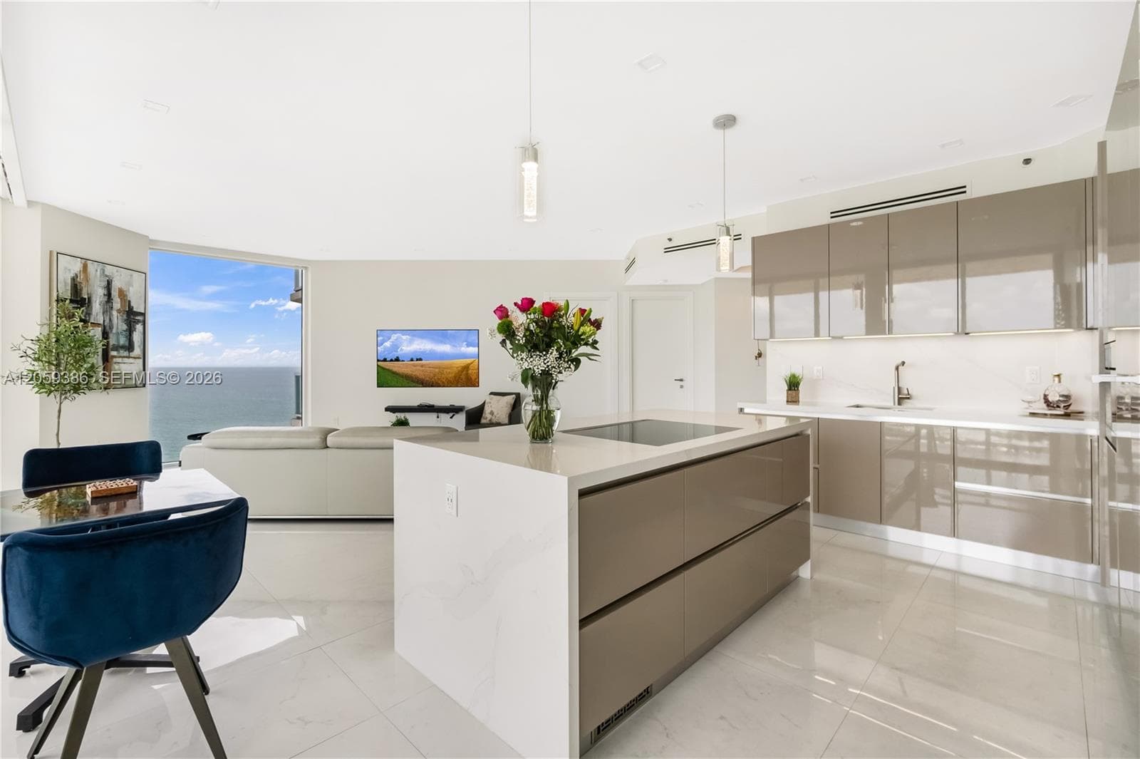 Italian cabinets, waterfall island, electric shades