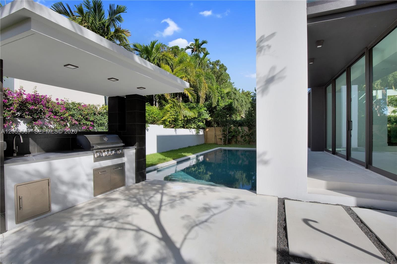 BBQ, Pool and covered porch back stucture.