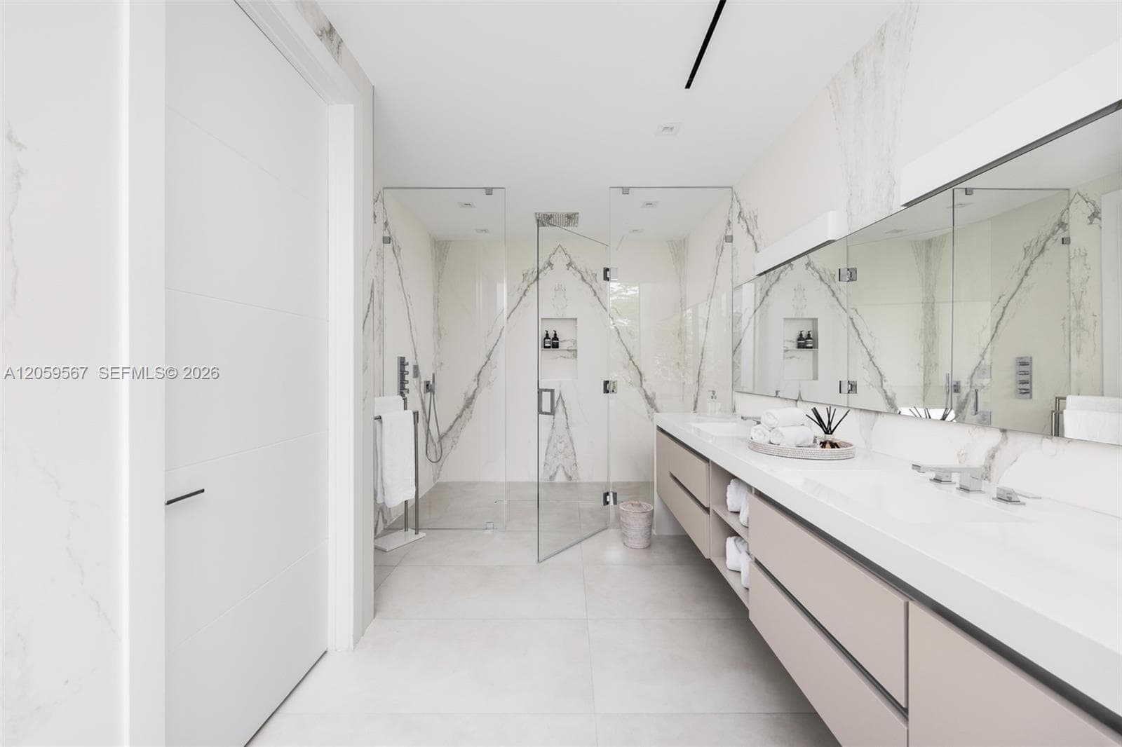 Primary bathroom with dual sink and spacious shower area