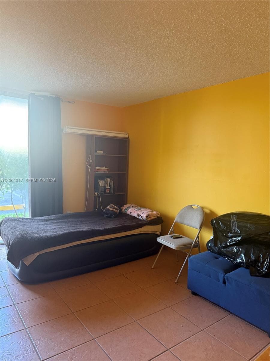 Spacious Master bedroom with a garden view.