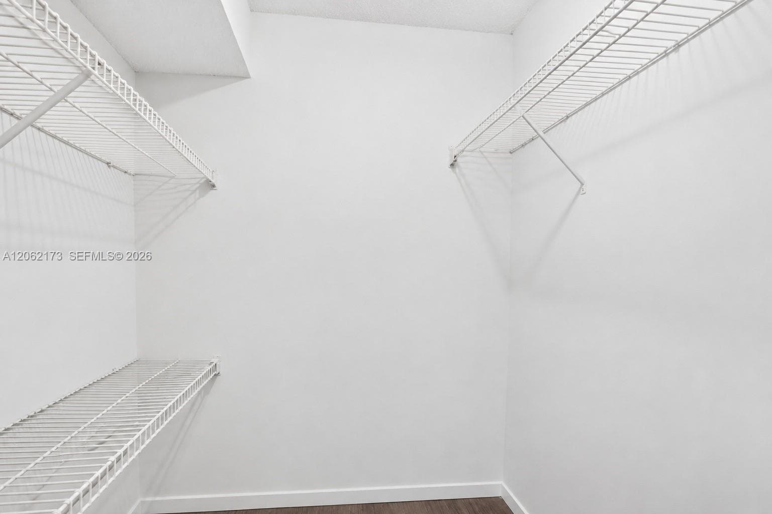 Primary bedroom walk-in closet