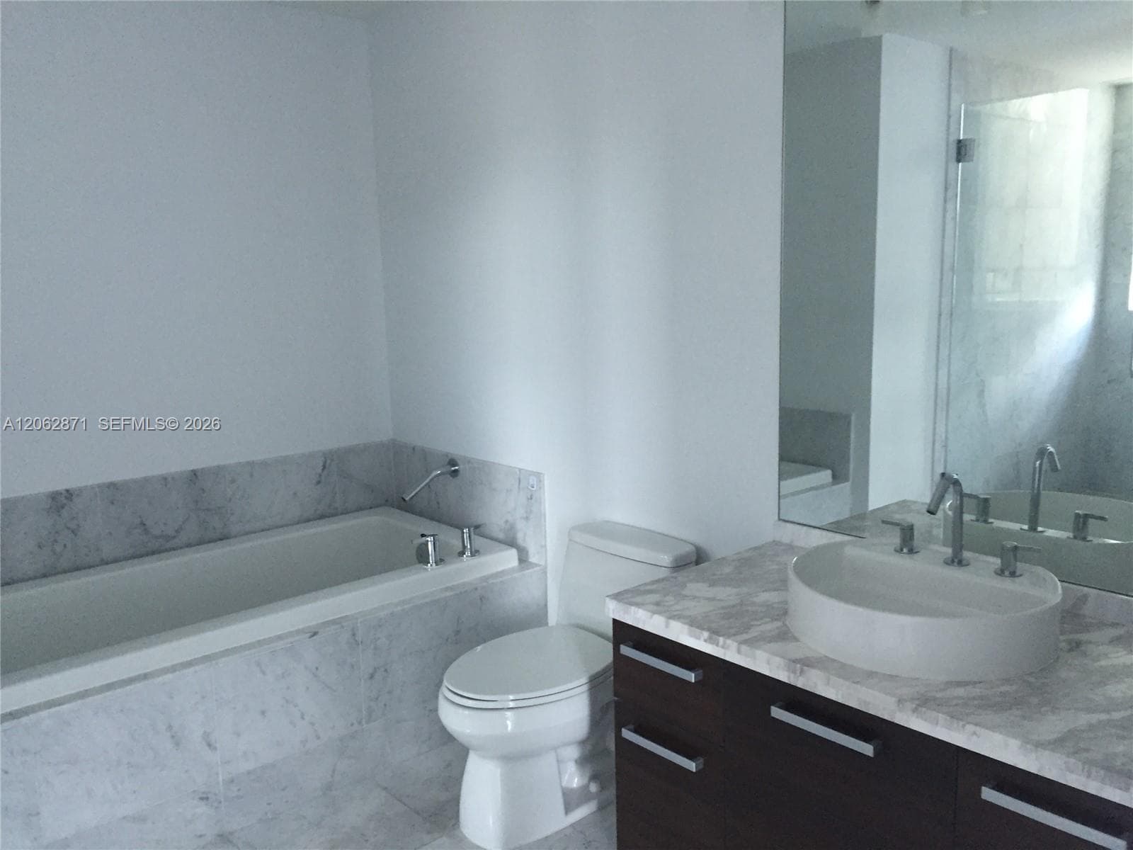 master bathroom with tub and shower