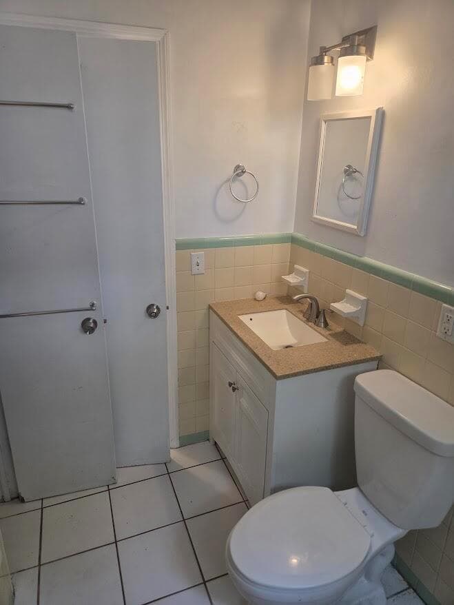 Bathroom sink and toilet and closet