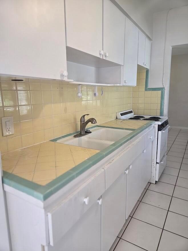 Kitchen sink stove and many cabinets