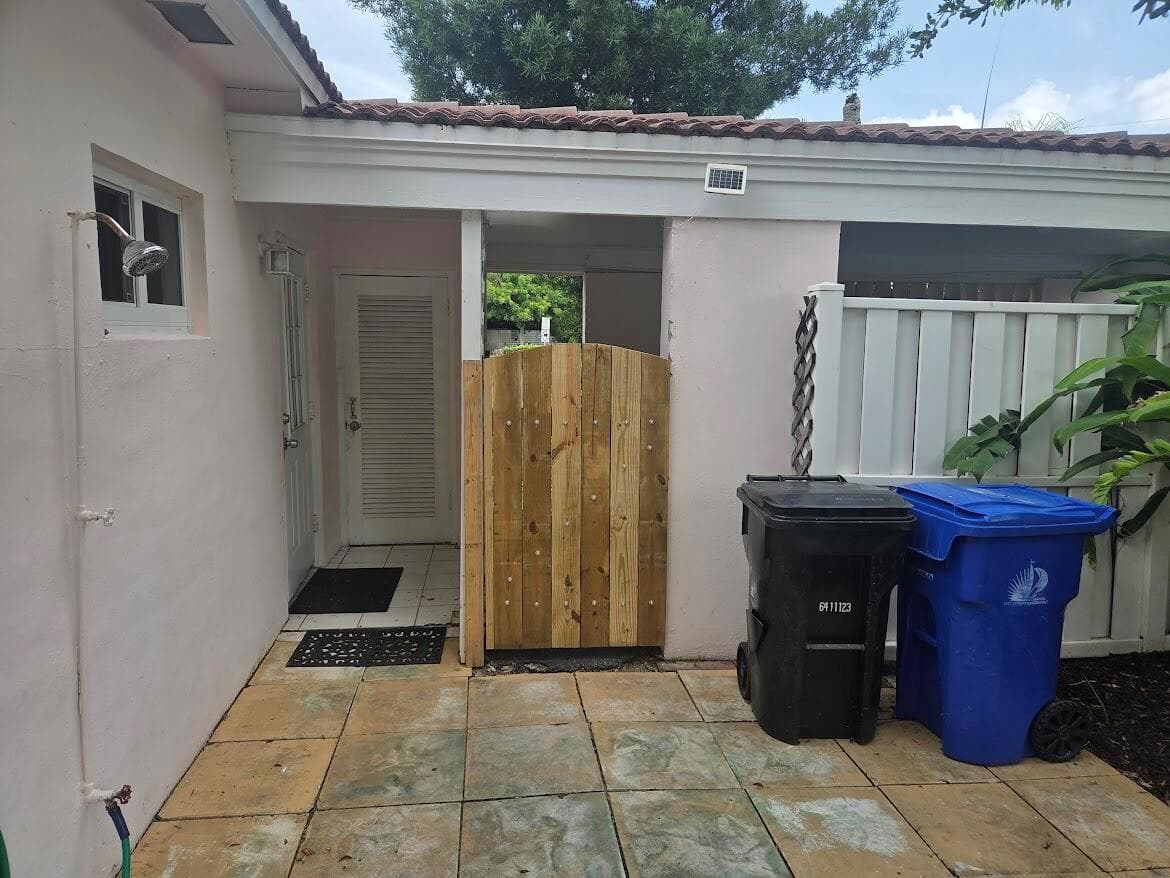 Backyard view to carport and storage clo