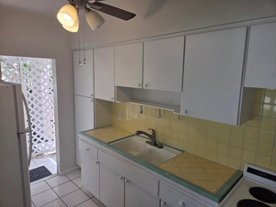 Kitchen view towards carport and backyar