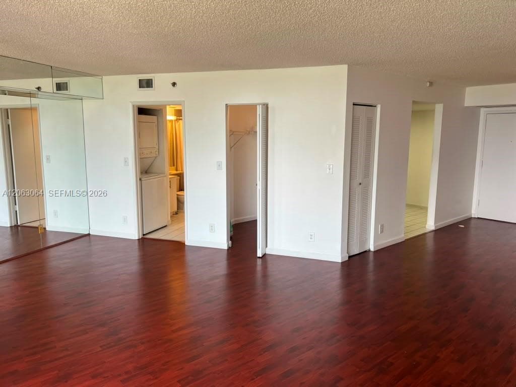 kitchen door on the right, 2nd bathroom door on left and extra closet next to it