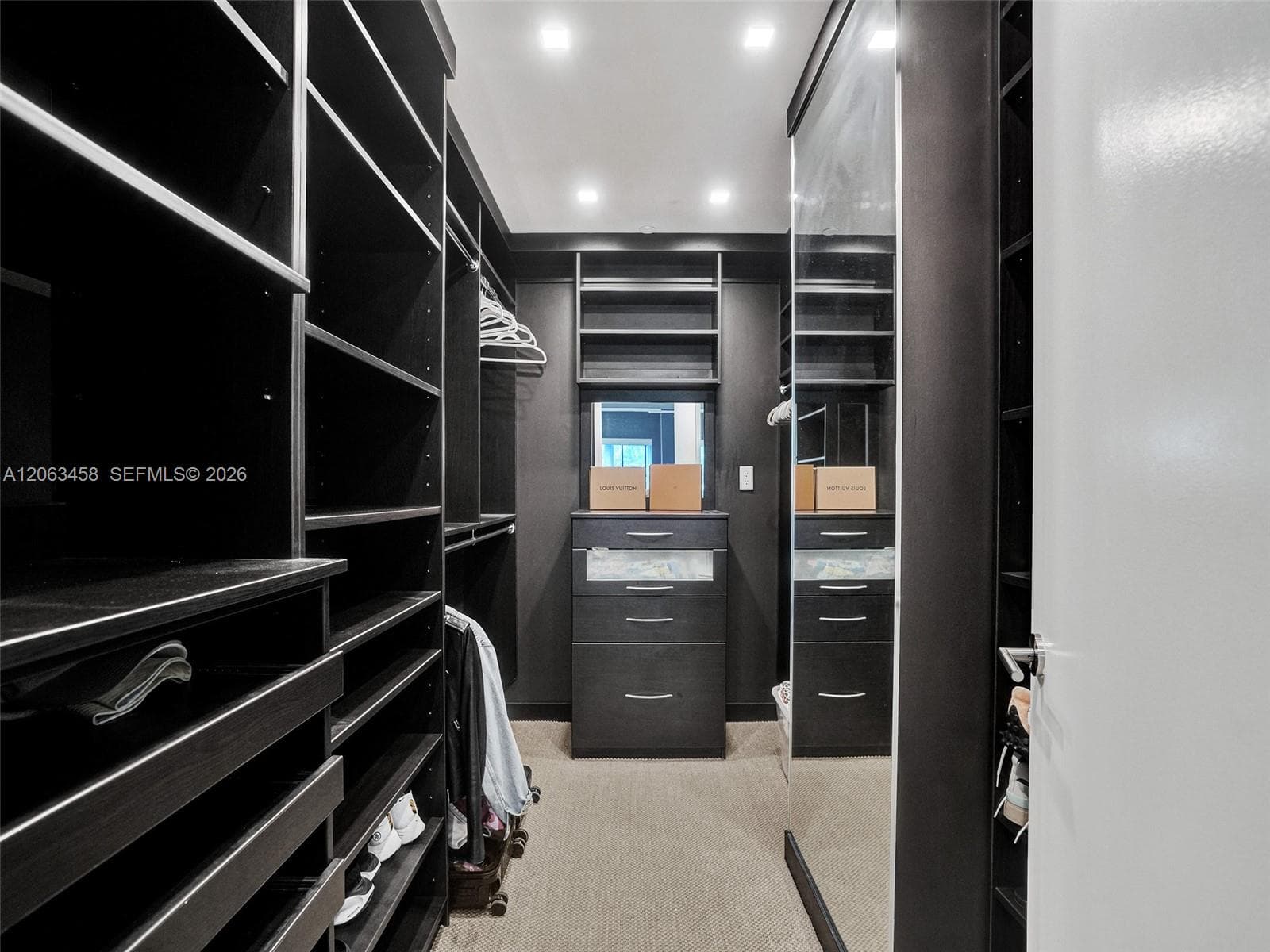 Primary bedroom walk-in closet