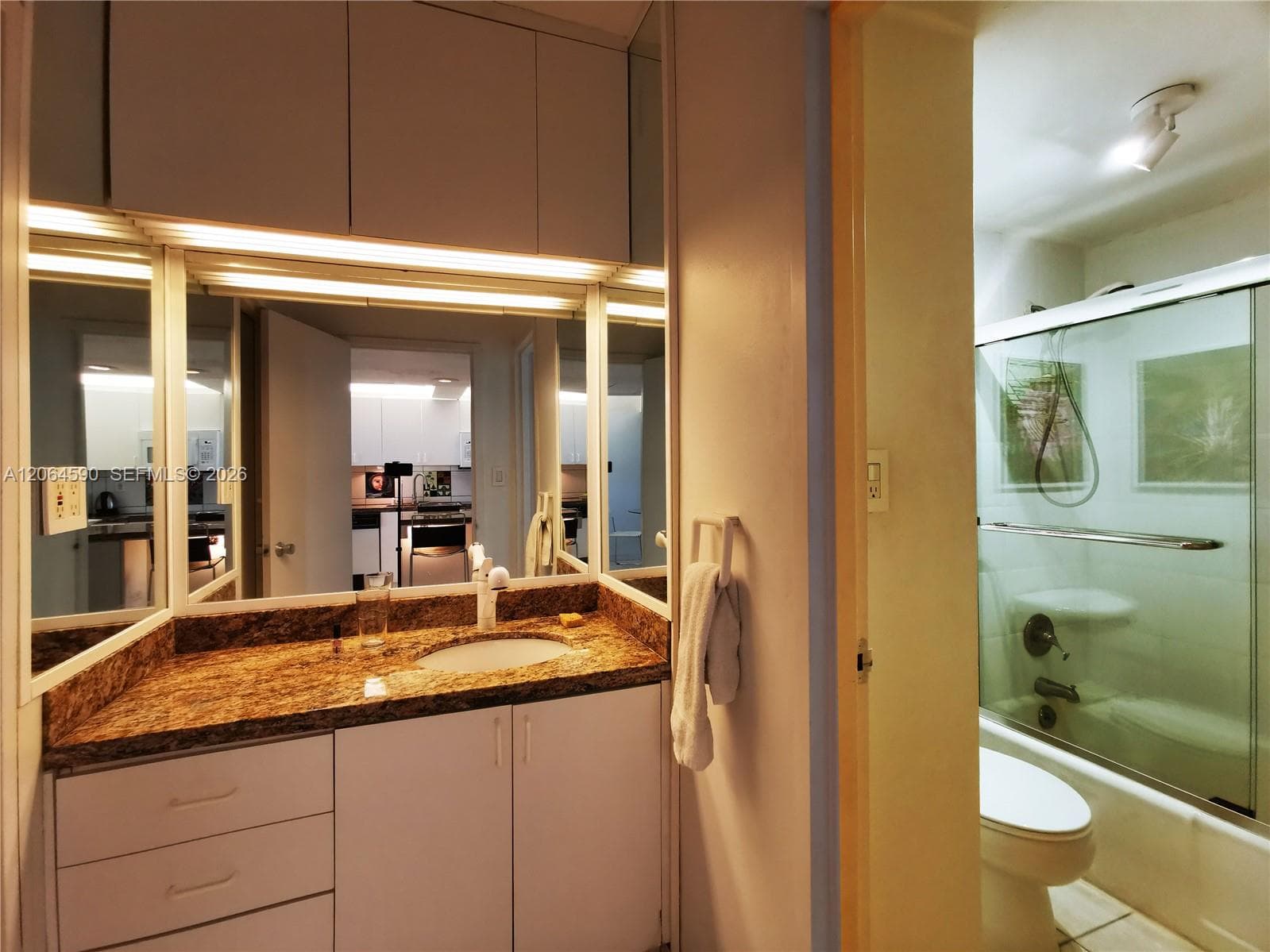 Vanity with recessed lights, extra closets for storage