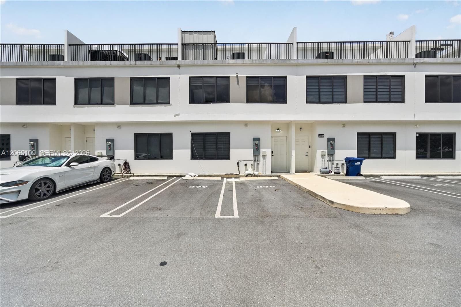 2 assigned parking spaces in back of structure
