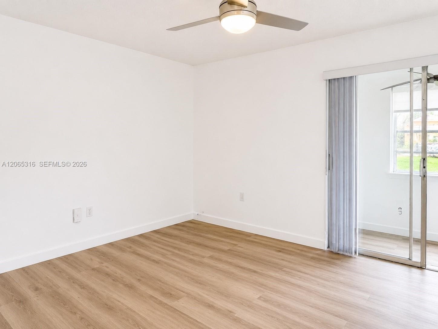Spacious primary bedroom with new flooring, fresh paint, and generous closet space.