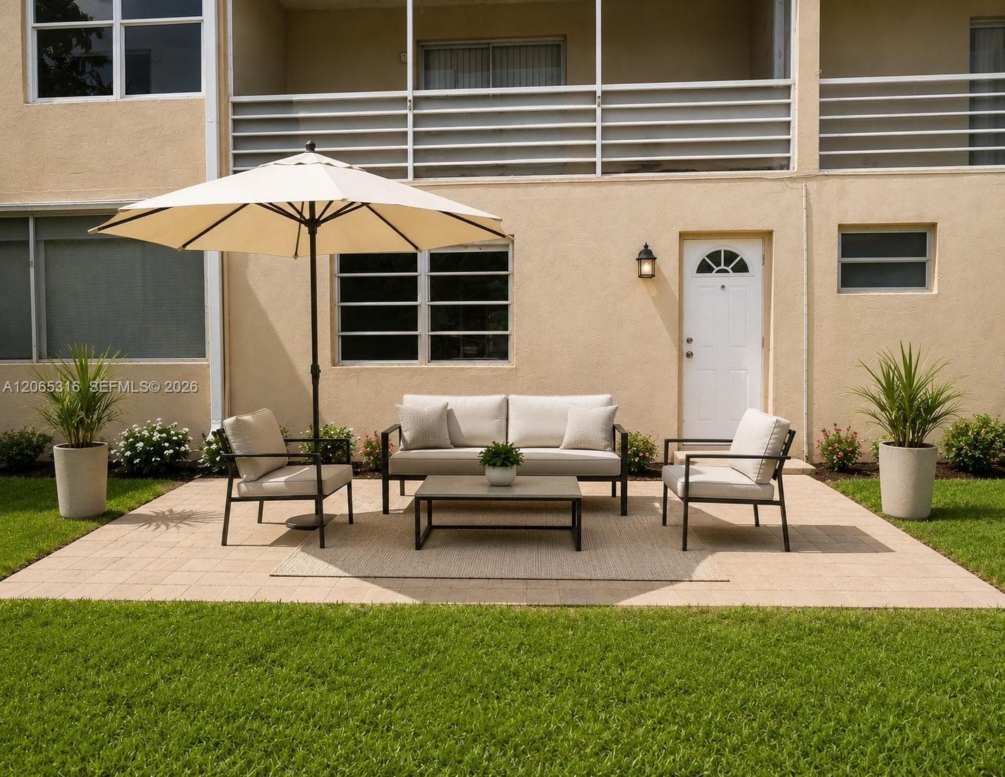 Inviting community outdoor seating area where residents can relax and enjoy the South Florida weather.
