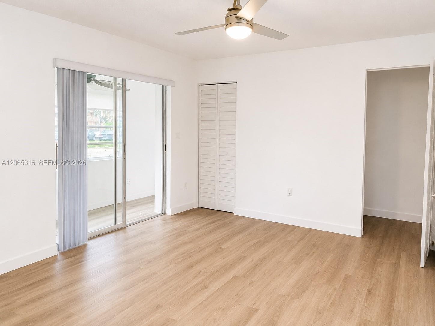 Bright primary bedroom offering flexible furniture placement and abundant natural light.
