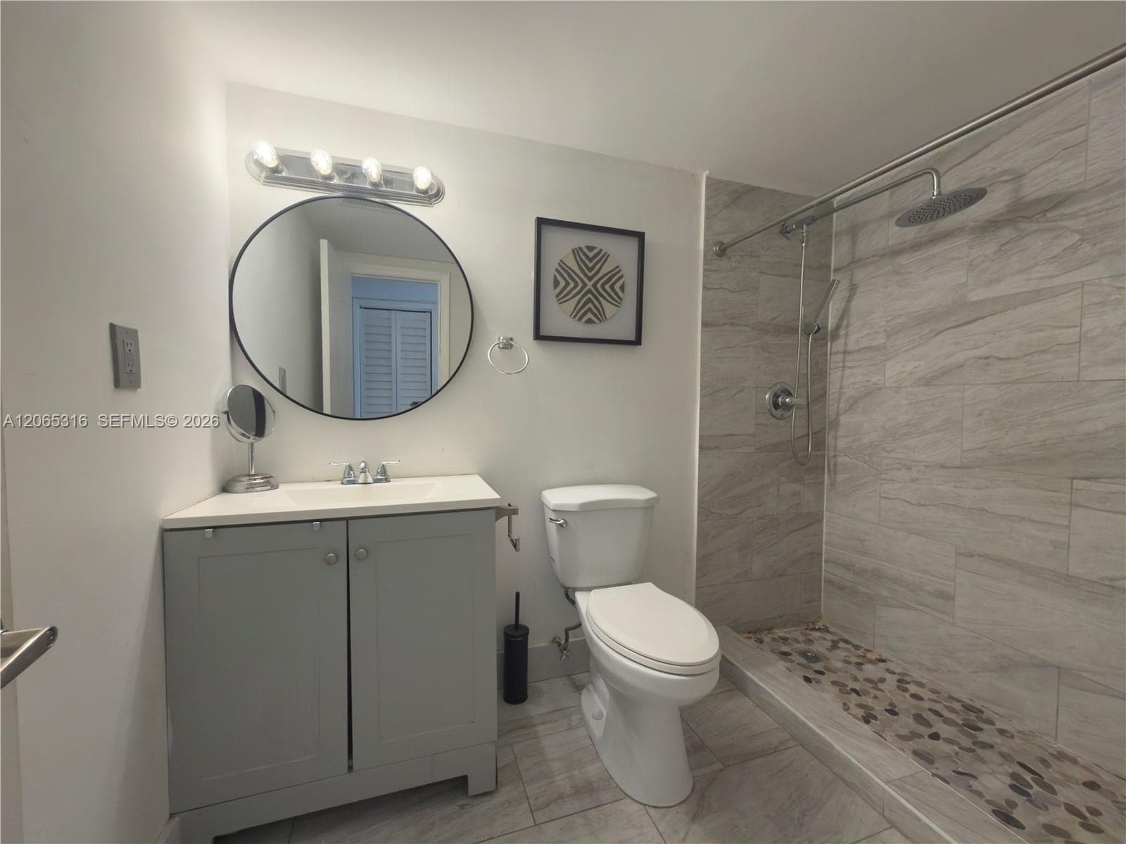 Renovated bathroom with clean, modern finishes.