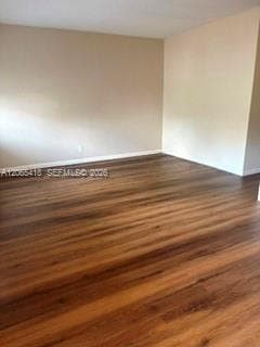Living room with wood laminate flooring.