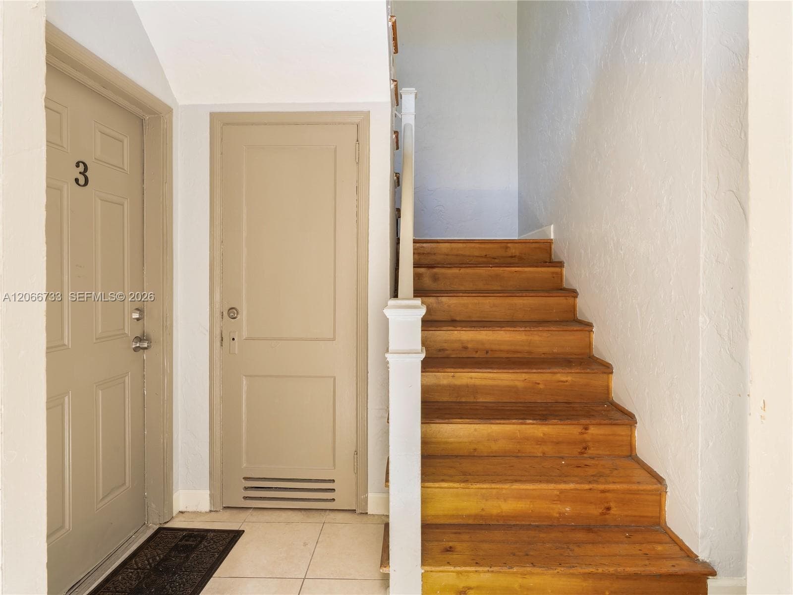 Unit is upstairs in interior hallway
