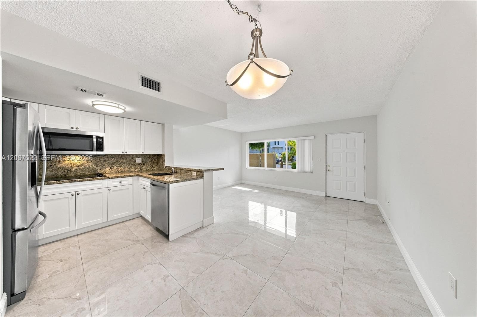 Spacious living and dinning room combo, convenient access to parking right outside the door.Unit backs to a courtyard not a street, excellent for privacy and security.