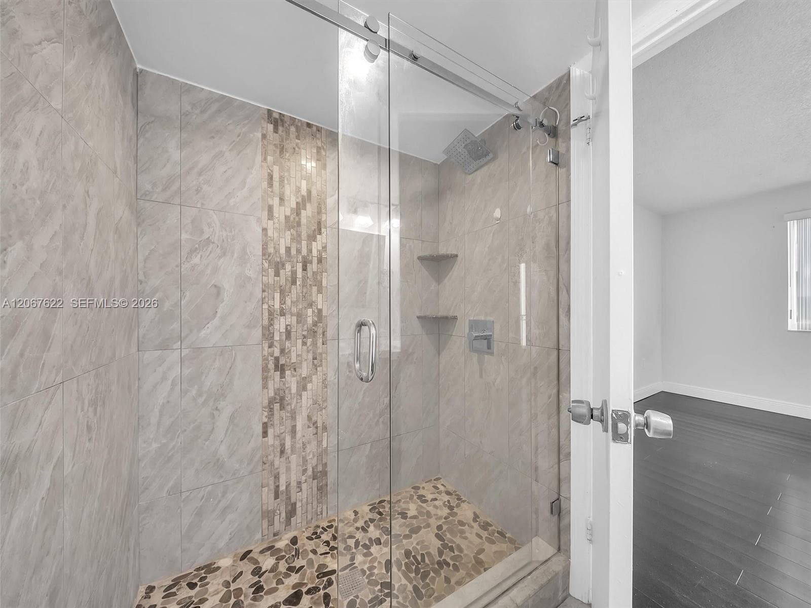 Primary bathroom with glass shower enclosure
