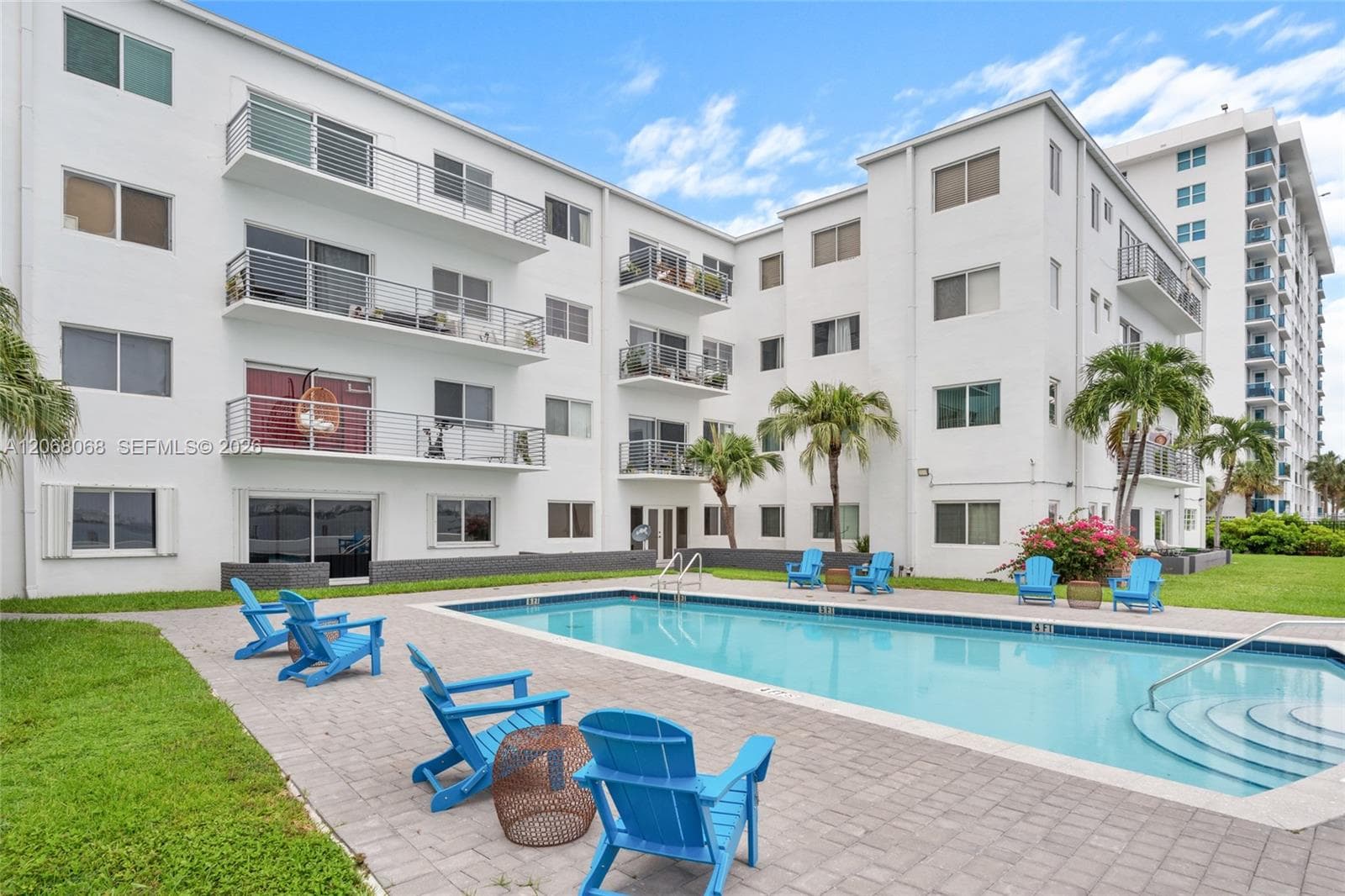 Pool and Building. Apt 4H is the top level apt right in the middle of the building