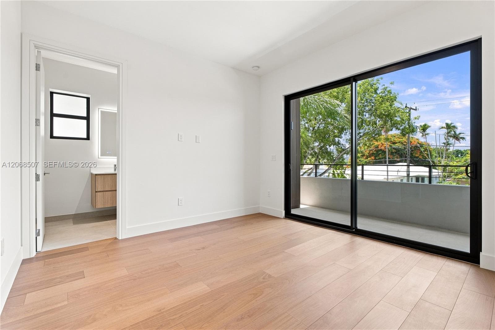 bedroom facing West with private balcony