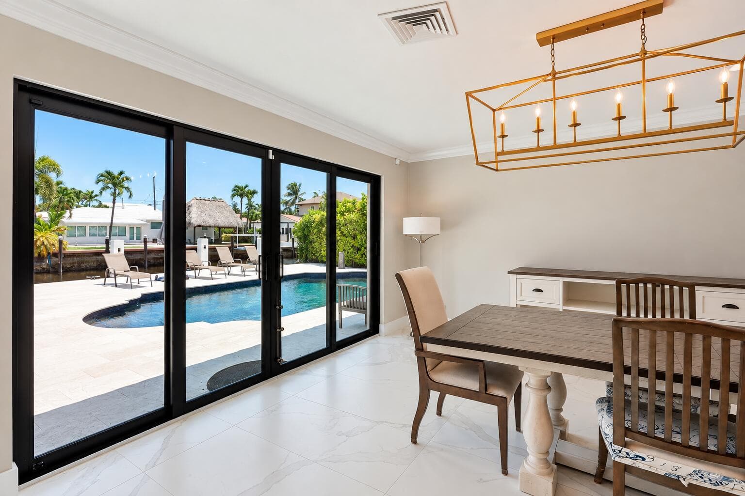 Bright Coastal Dining Room with Pool Vie