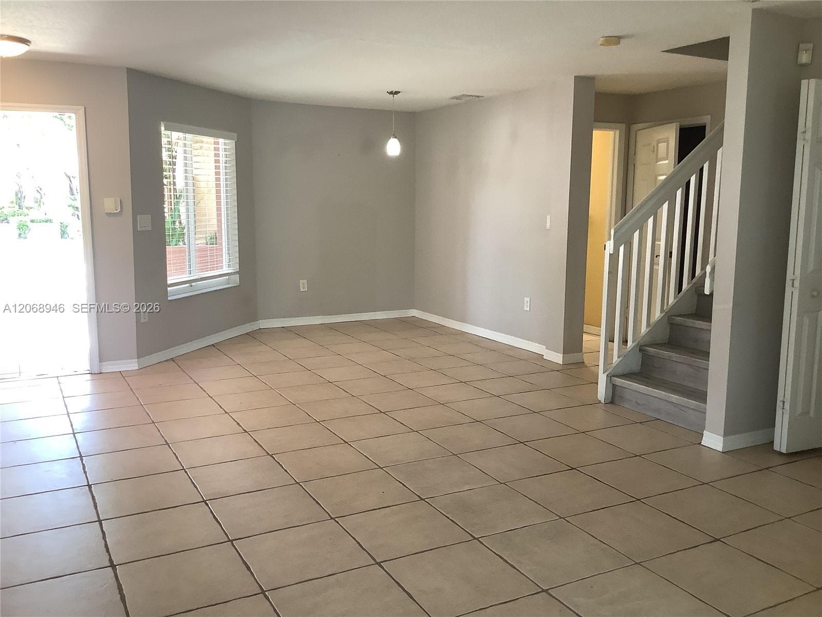 looking from the living room towards the dining and the entrance