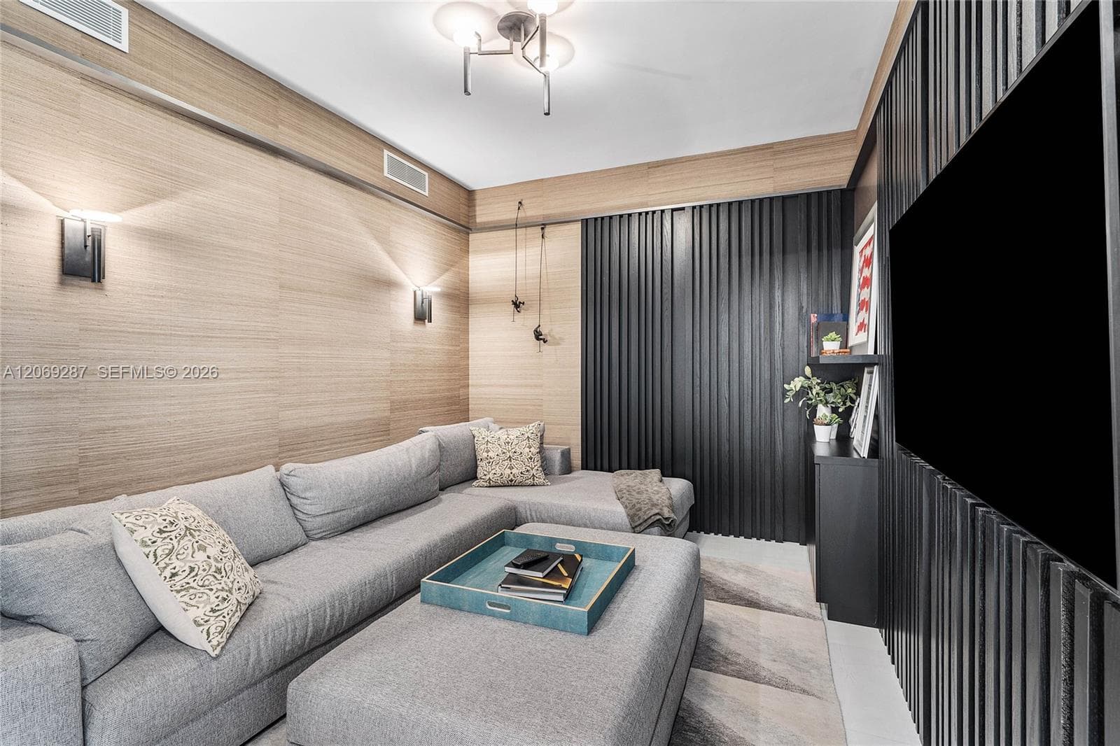 A versatile den offering an intimate setting for a home office, media room or guest retreat.