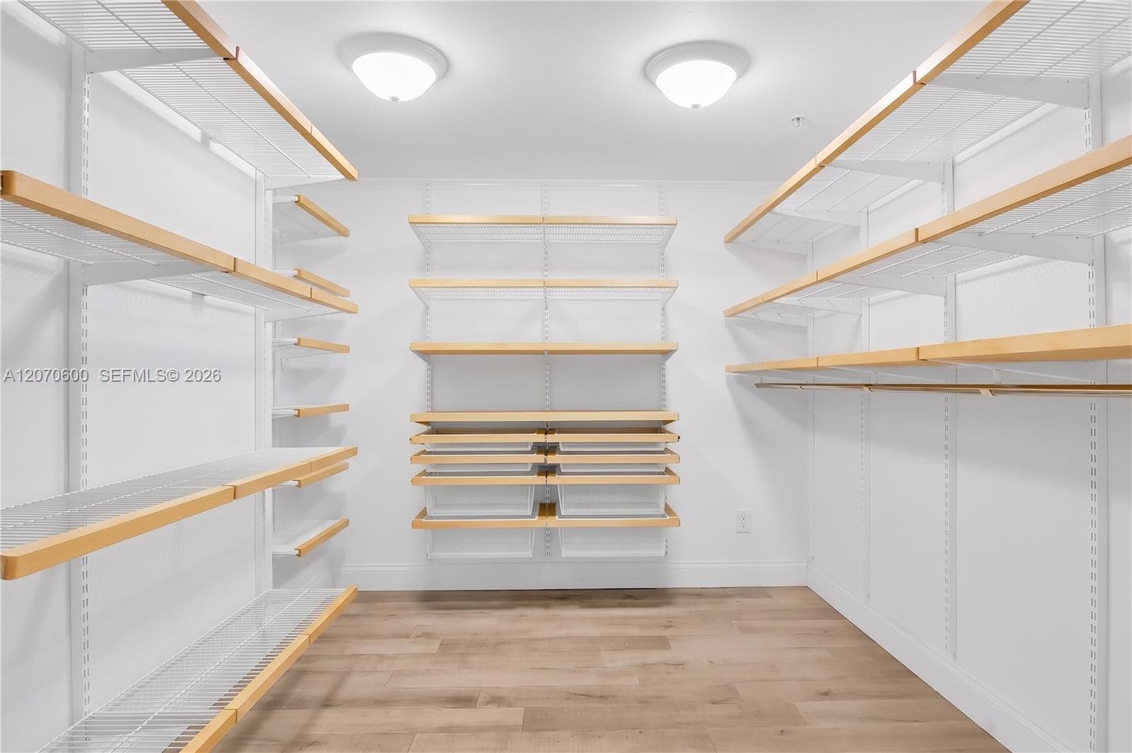 Primary bedroom walk in closet