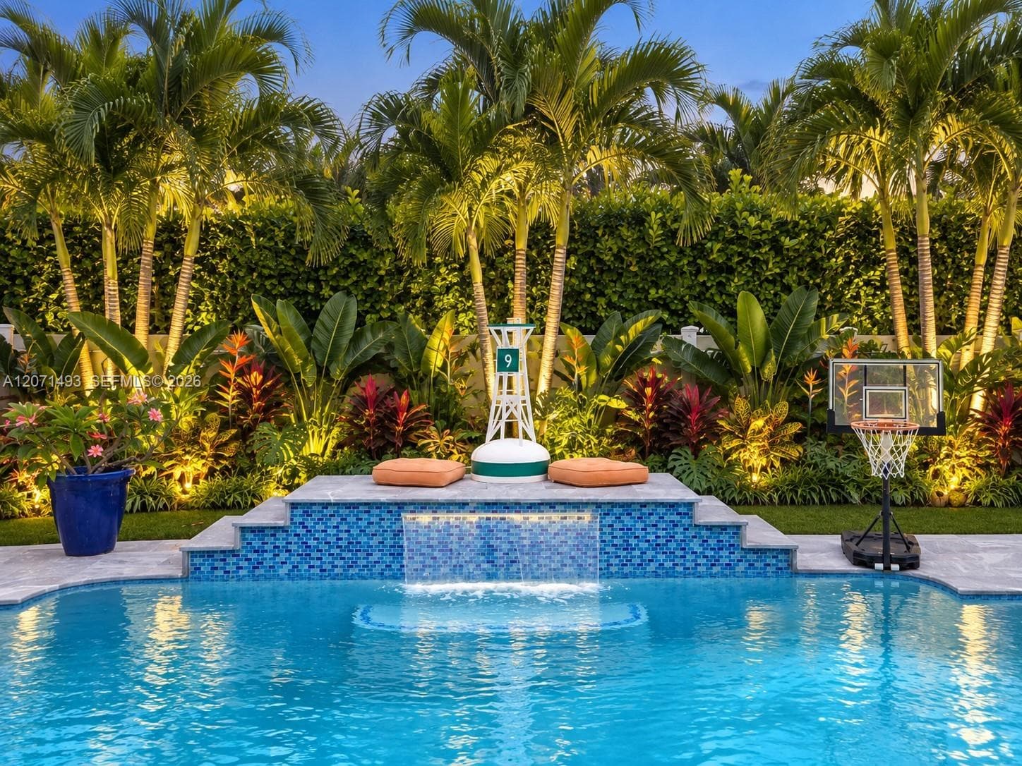 Virtually staged to help visualize a tropical private pool area and inspire landscaping ideas.