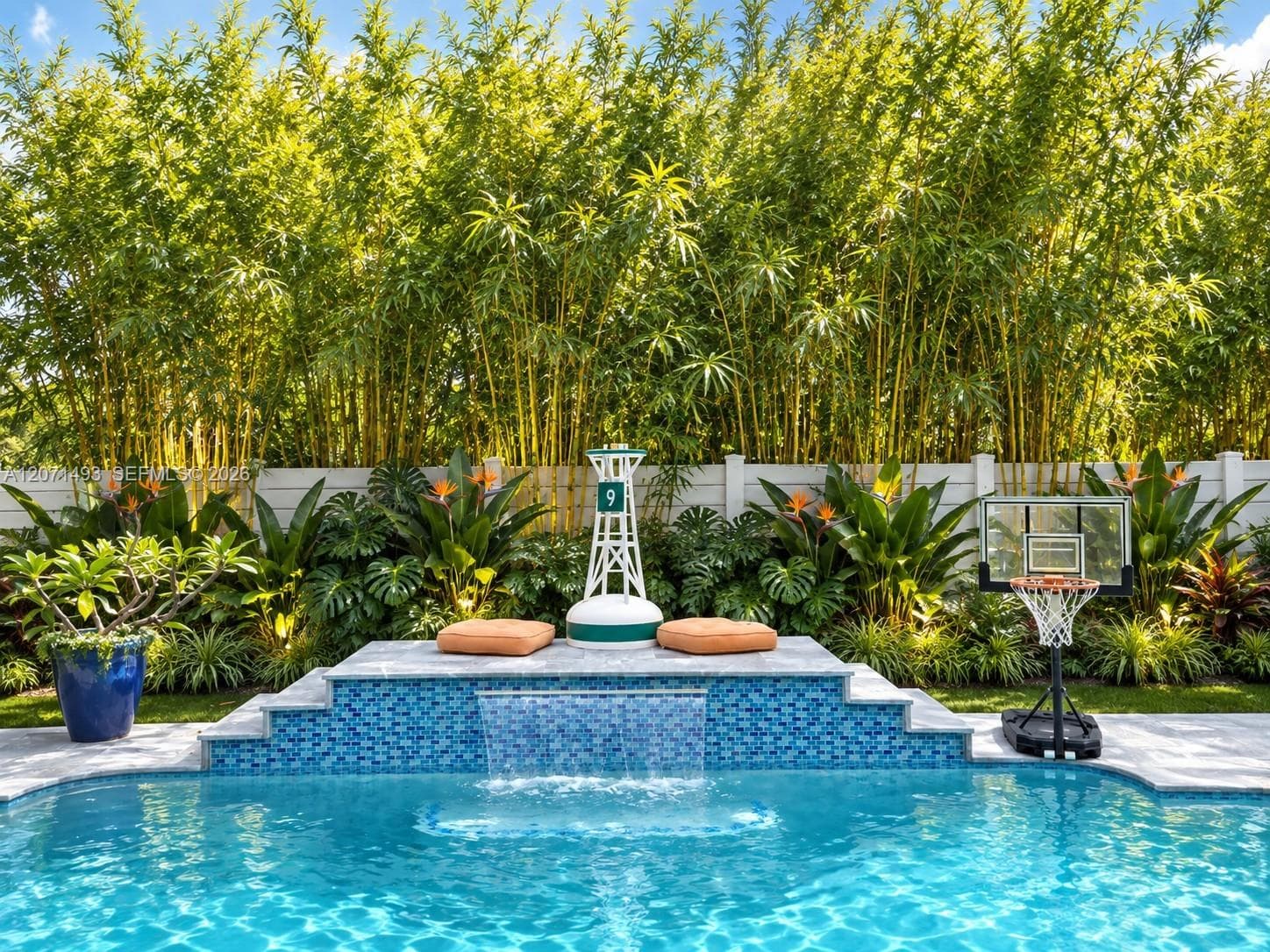 Virtually staged to help visualize a tropical private pool area and inspire landscaping ideas.