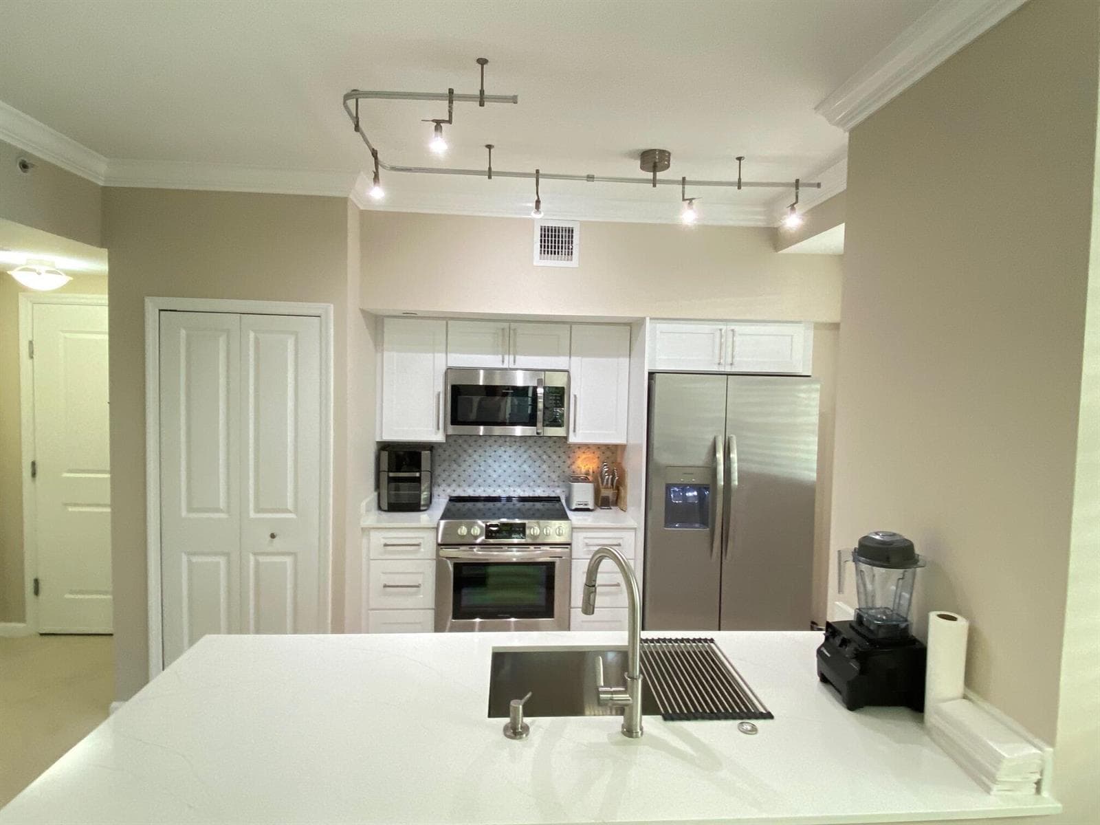 Kitchen Showing Washer Dryer & Pantry