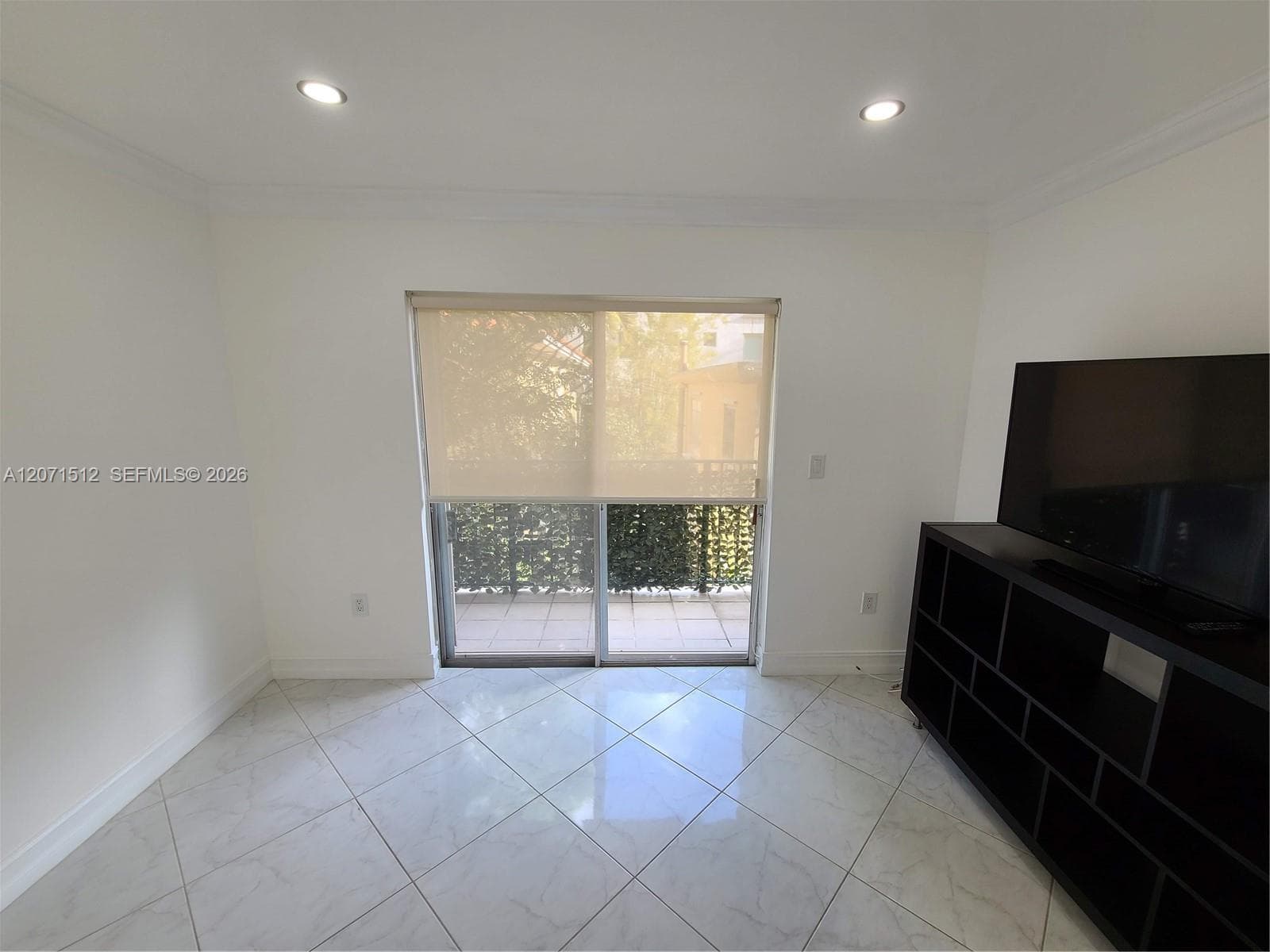 From middle of living room looking towards balcony