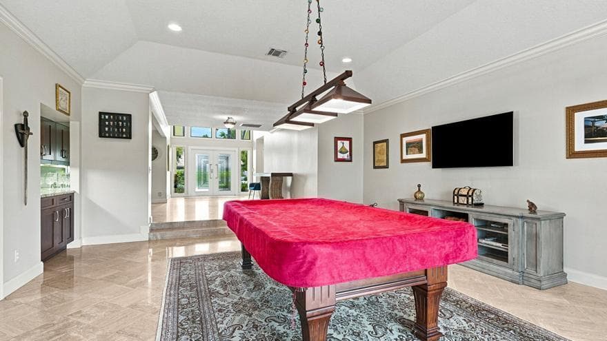 Gameroom Leads Out to Lakefront Lanai