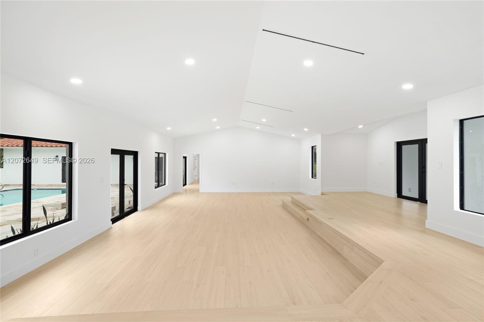 Living room has a bid and independent hallway that separates the social area from the private quarters