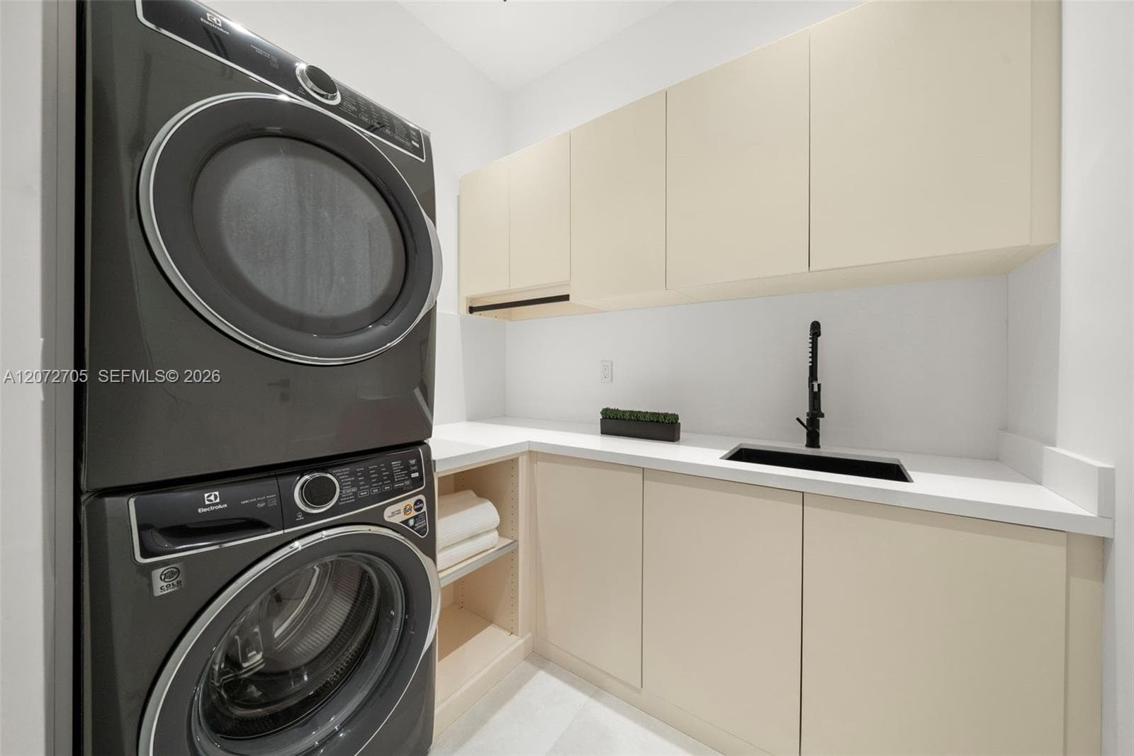 Luadry room with sink. Electrolux Washer/Dryer