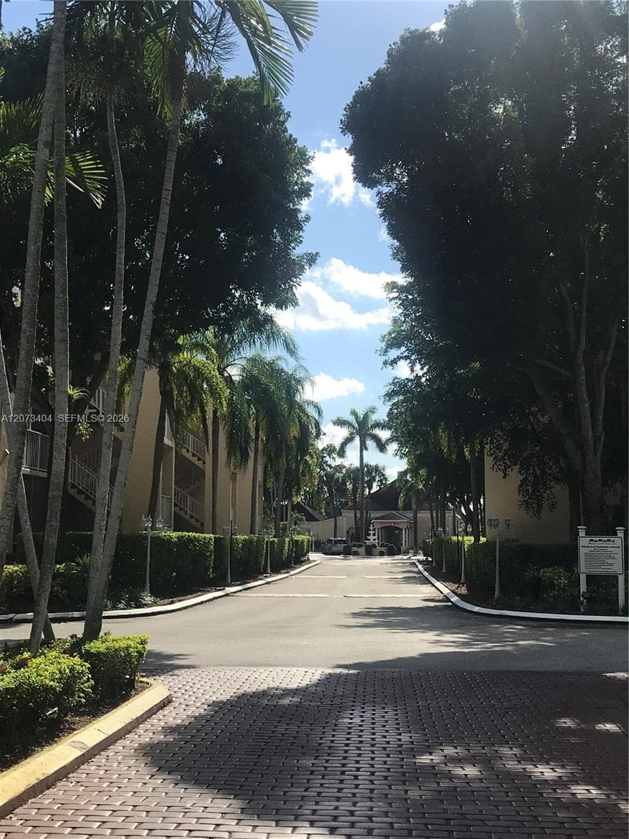 ENTRANCE TO COMPLEX, AT THE END THE ASSOCIATION OFFICE, GYM, POOL AND PARTY ROOM